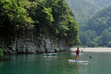 We could also practice stand-up paddlesurfing.