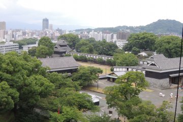 Contrast between the traditional Japanese buildings and the modern city