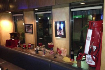 <p>Sports decorations mix with bottles of wine on display in Sideways' window</p>
