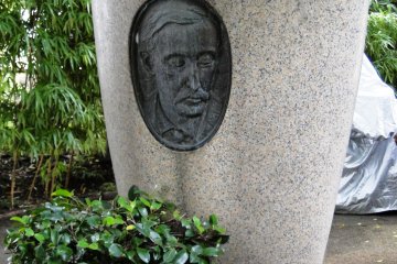 A plaque of the author in the garden
