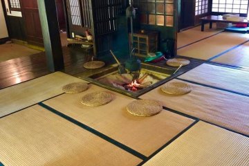 Traditional Japanese fireplace called "irori" used to this day for cooking, as well as preserving the wood beams supporting the ceiling