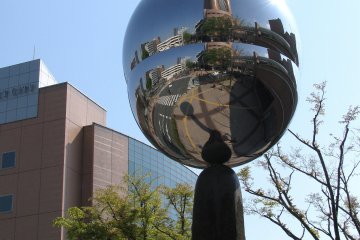 Mirror object reflecting Hamamatsu Square