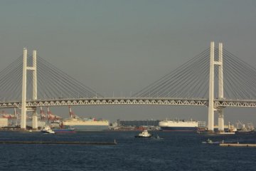 In addition to beautiful sea and sky, you can also see Mt. Fuji, the Minato-Mirai skyline including Landmark Tower, central Yokohama, the Marine Tower, the Hotel New Grand, the Hikawa-Maru oceanliner, the Yamate Bluff area, and finally…Yokohama Bay Bridge