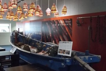 <p>A traditional fishing boat, with cute lamps overhead</p>
