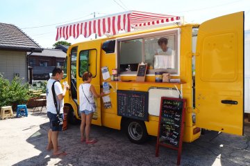 You can get your lunch at the 'Flourjams' food truck. This serves hot sandwiches and curry 