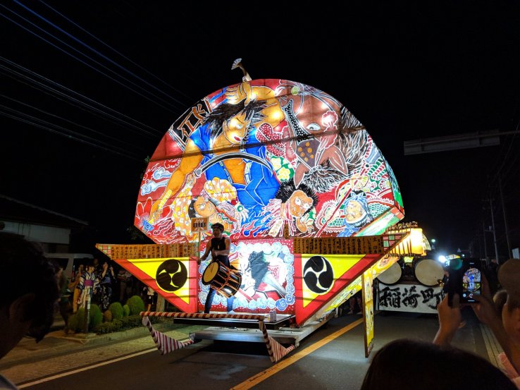 Fan-shaped floats similar to Hirosaki's nebuta style.