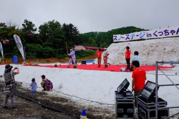 Adults blindfolded and attempting to crack the watermellon