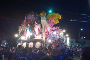 Live flames on a float at night