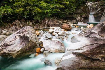 Waterfalls with huge boulders flow throughout the Houri River Valley