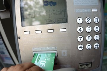 Insert a phone card into the telephone and follow the on-screen instructions.
