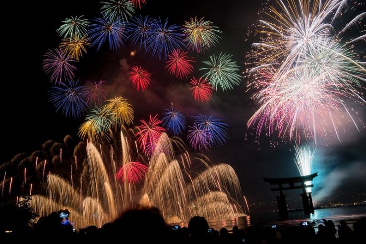 A perfect shot of the torii against the fireworks