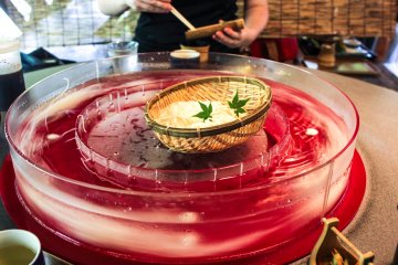 Noodles swirling at a restaurant perched above a river