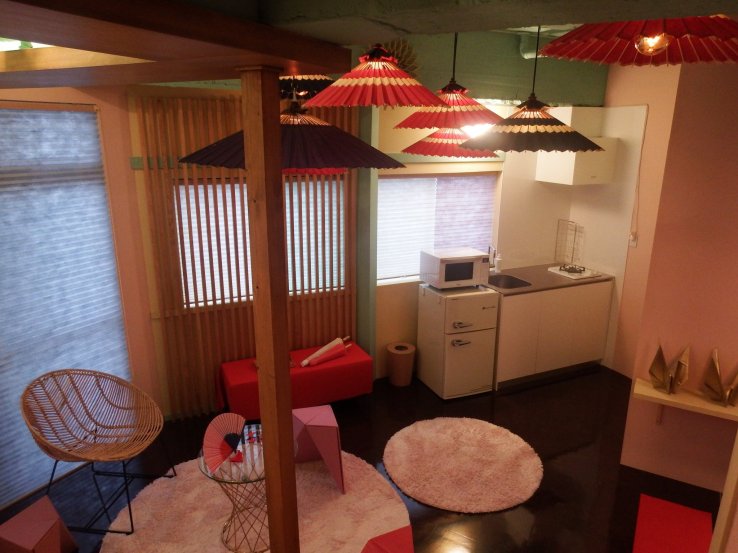 The living area connects to mini fridge and kitchen.