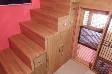 Stairs that lead to the top beds.