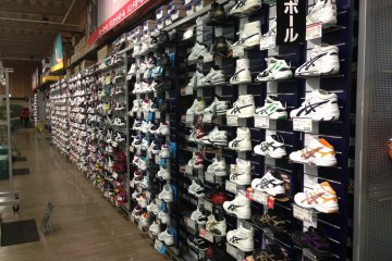 Team sport footwear takes up a long section of this wall at Sports Depot