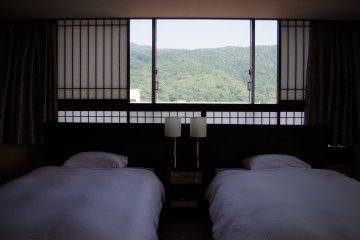 Two single beds in the Western part with paper windows