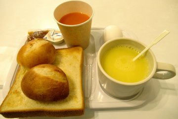 Corn soup, toast, buns and juice for breakfast