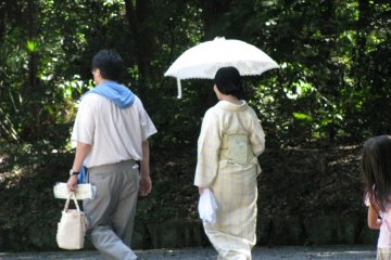 Japanese ladies using sun-proof umbrellas...