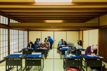 Revel in the quiet serenity of the sutra copying