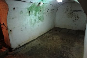 The spots on the walls are the aftermath of seppuku at the Former Japanese Navy Underground Headquarters