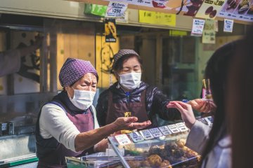 Food handlers often wear masks as a courtesy