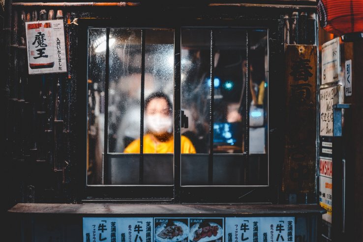 A young boy wears a mask to protect himself