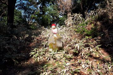 A sun drenched jizo statue