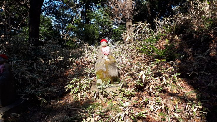 A sun drenched jizo statue