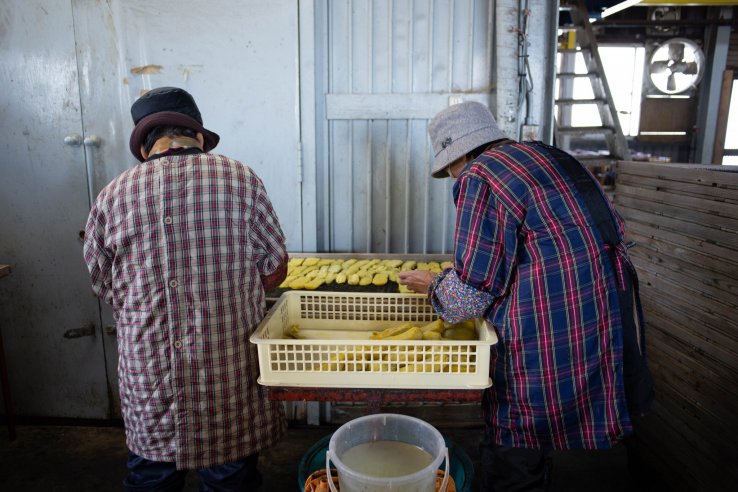 Workers preparing dried sweet potato at Nousanbutsu Kakou Konya