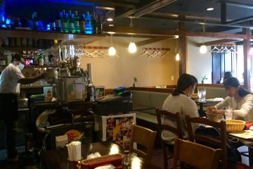 Cozy booths and dark wood tables.