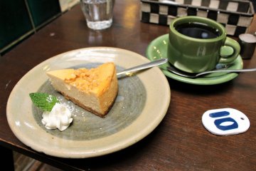 A caramel cheese cake and coffee