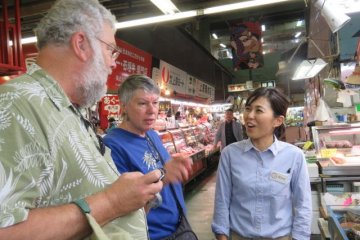 Rina’s deft navigation through this Aladdin’s cave of fresh produce saves the day. Her eye in discerning the best ingredients in the market that we will cook in the cooking class, the selection of the pork belly was the foundation of our cooking class at the Taste of Okinawa cooking studio.