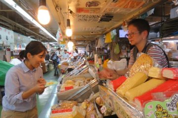 The narrow alleyways in the market allow us to have one on one conversations and discoveries with the owner of this fish cake stall.
