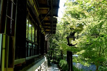 Path between an old inn and Katsura River