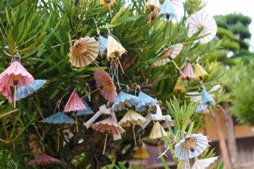 Small umbrellas serve as omikuji (fortunes)