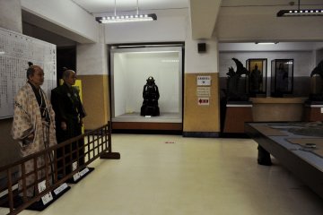 There are some objects displayed inside the castle. However, none of the information includes English translations.