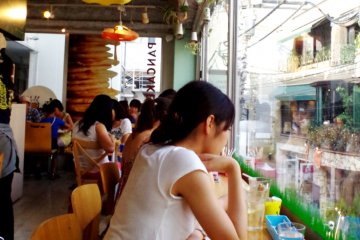 <p>People Watching from the Floor to Ceiling Windows at Pancake Days</p>