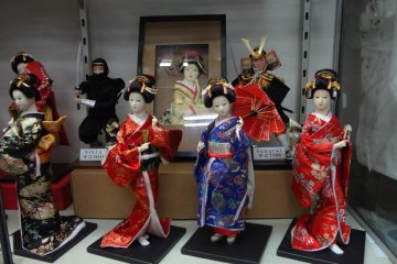 Female dolls feature kimono and traditional Japanese hairstyles, while male dolls sport samurai and ninja costumes.
