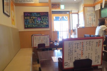 The brightly lit restaurant with its decorations has a fun and comfortable atmosphere