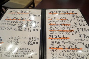 The handwritten menu with affordable prices and details about each dish