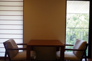 Japanese paper window makes an artful contrast with the western furniture