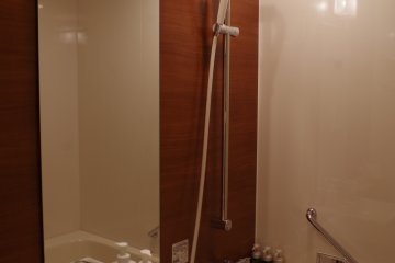 Nicely designed western style bathroom decorated with natural materials like wood