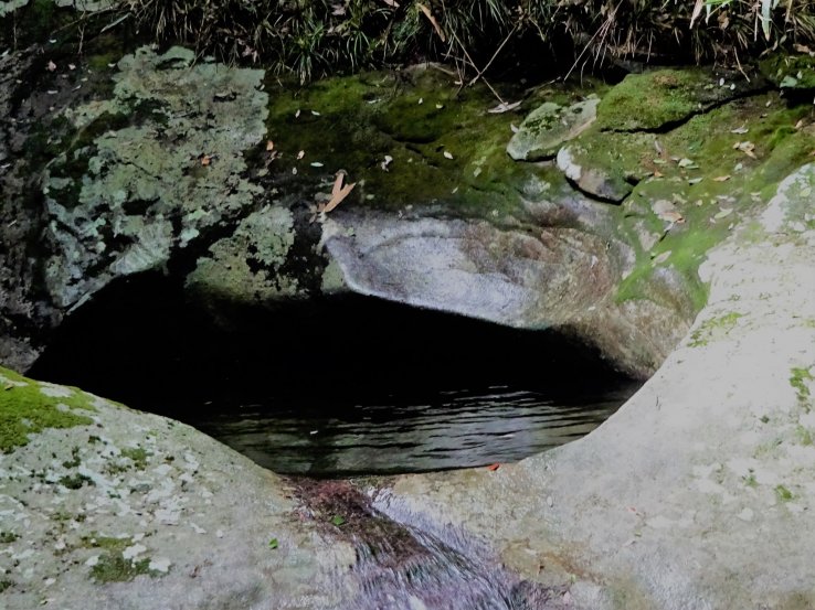 A deep pool is left where once a waterfall was. 