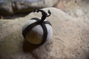 A piece of stone that restrict visitors to access a door.
