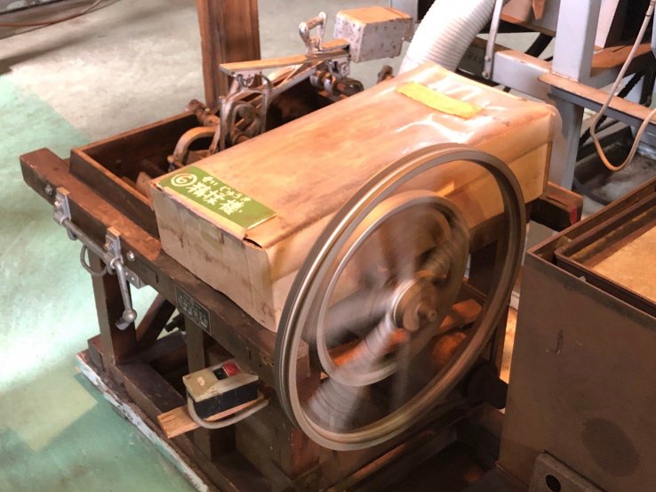 A smaller and older machine to roll the tea leaves