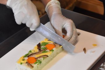 Cutting the kokera sushi