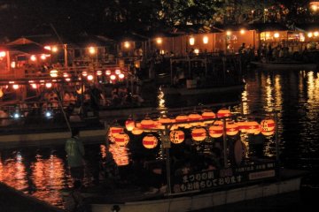 Pleasure boats take customers onto the lake to enjoy the festivities