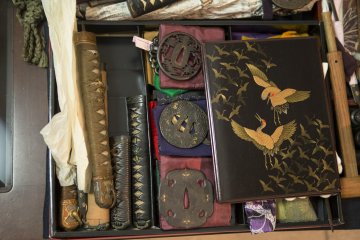 Some Tsuba and Tsuka (handles) laid on the table possibly waiting to also go on display. The Lacquered box really caught my eye though.