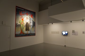 Also on display was large painting of the three motifs of the film. The film was a juxtaposition of Jidaki geki films, the works of Yasujirō Ozu as well as anime such as Evangelion