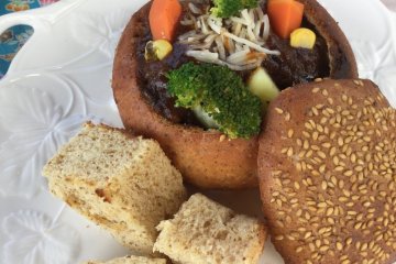 Tender beef stew in homemade bread